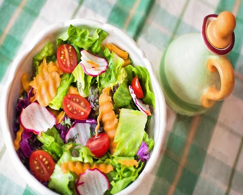 Colorful salad bowl with healthy greens and vegetables